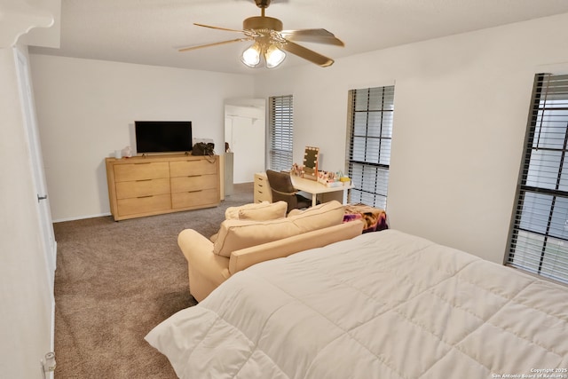 bedroom with light carpet and ceiling fan