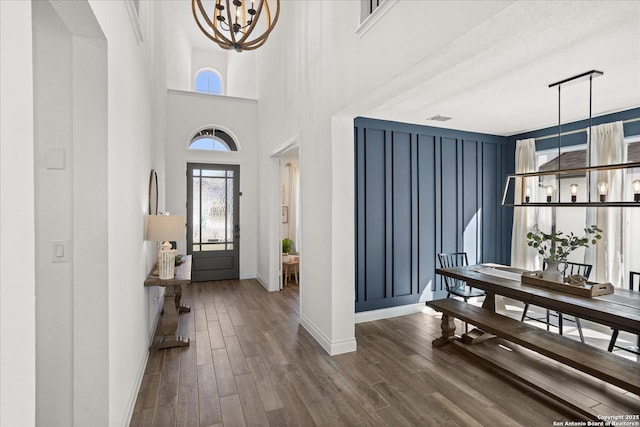 foyer entrance featuring a textured ceiling and an inviting chandelier