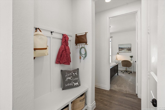 mudroom with dark hardwood / wood-style flooring