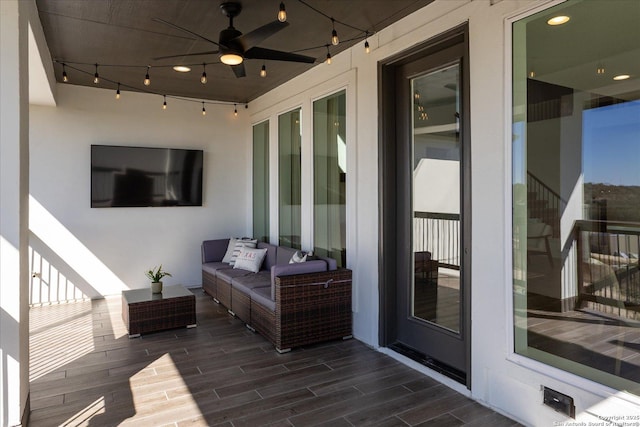 deck featuring ceiling fan and an outdoor hangout area