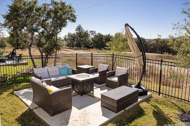 view of patio / terrace featuring an outdoor living space with a fire pit