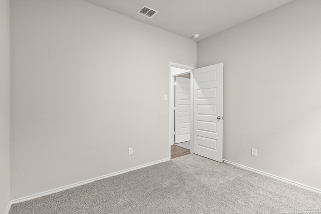 spare room featuring carpet floors