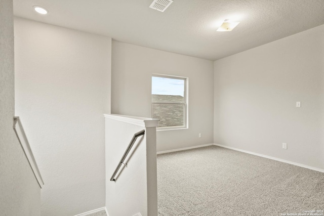 empty room featuring carpet floors