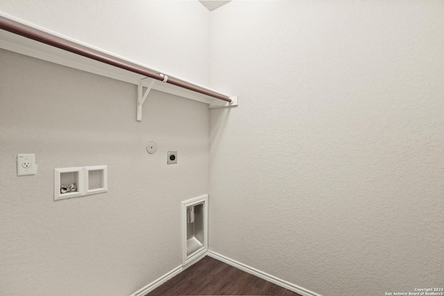 clothes washing area with hookup for an electric dryer, hookup for a gas dryer, dark hardwood / wood-style flooring, and washer hookup