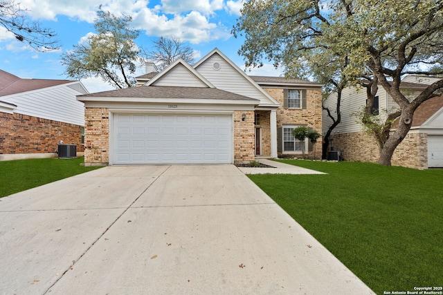 view of front of property featuring a front yard, central air condition unit, and a garage