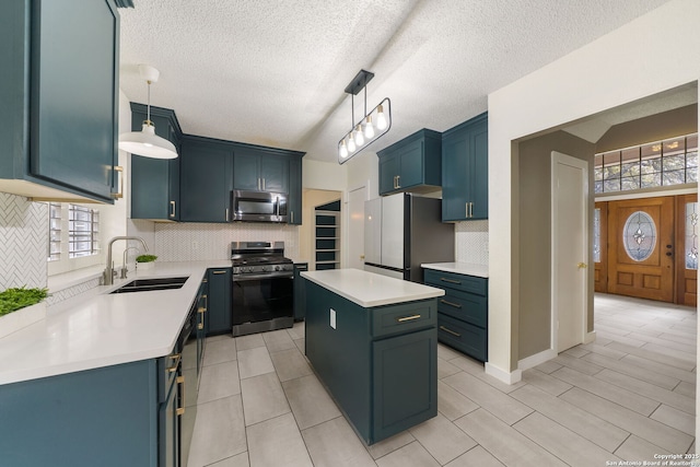 kitchen with a kitchen island, decorative light fixtures, stainless steel appliances, decorative backsplash, and sink