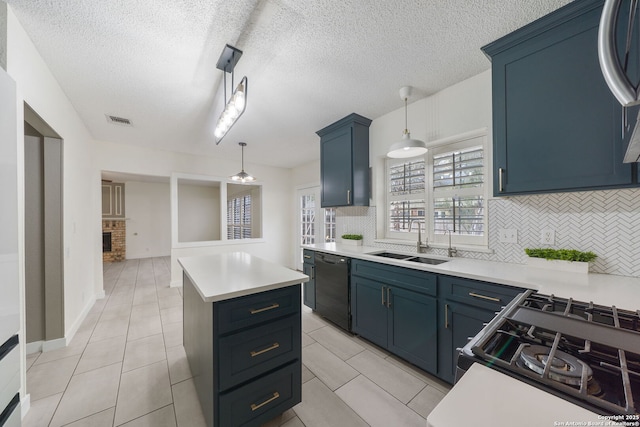 kitchen with a center island, sink, black dishwasher, and pendant lighting