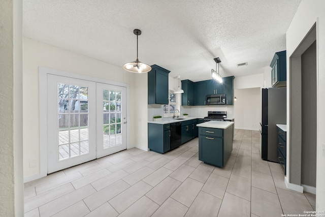 kitchen with decorative light fixtures, blue cabinetry, appliances with stainless steel finishes, and a center island