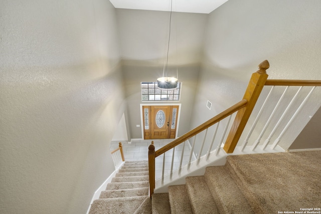 stairway with a towering ceiling