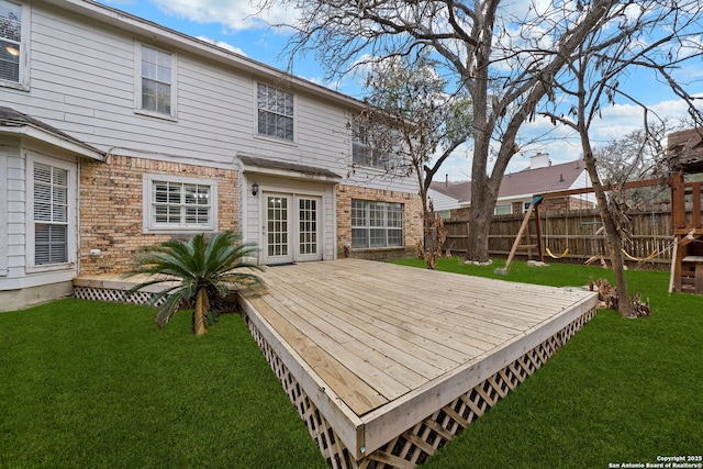 wooden terrace with a yard