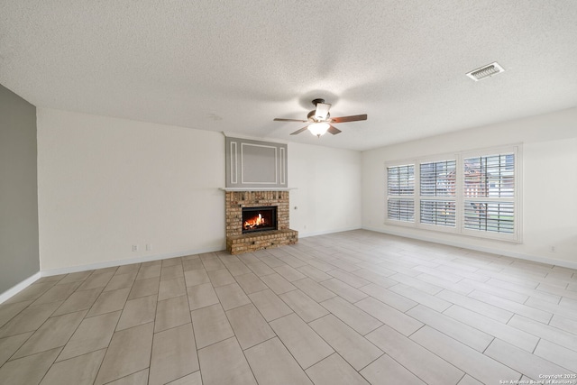 unfurnished living room featuring ceiling fan and a fireplace