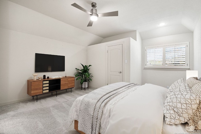 carpeted bedroom with ceiling fan and lofted ceiling