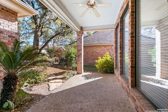 exterior space featuring ceiling fan