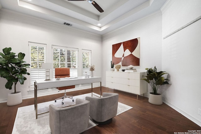 home office with a raised ceiling, ceiling fan, dark hardwood / wood-style flooring, and a high ceiling