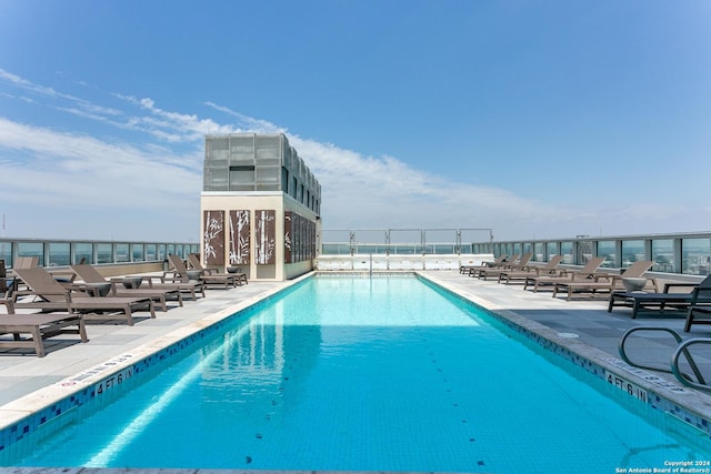 view of swimming pool featuring a patio area