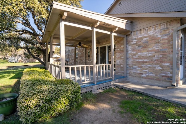 exterior space with ceiling fan