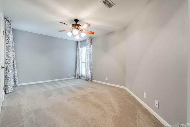 unfurnished room featuring ceiling fan and light colored carpet