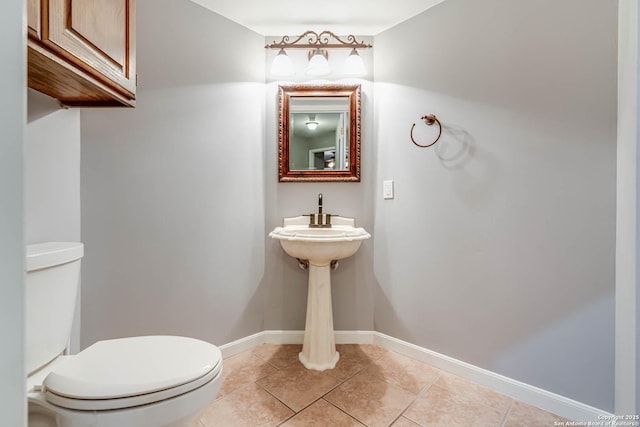 bathroom featuring tile patterned flooring and toilet