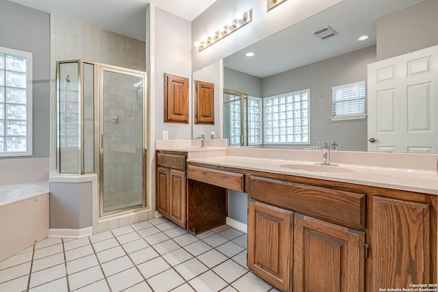 bathroom featuring tile patterned flooring, vanity, and independent shower and bath