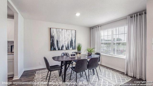 dining space featuring hardwood / wood-style floors