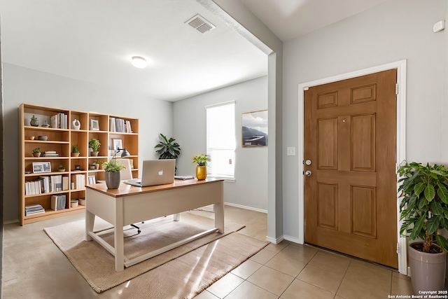 office area with light tile patterned floors