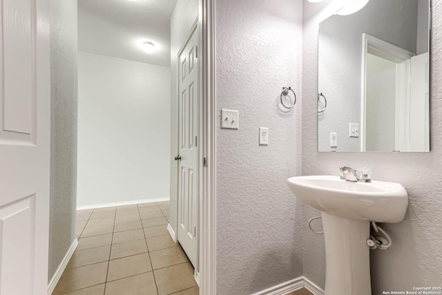 bathroom with tile patterned floors and sink