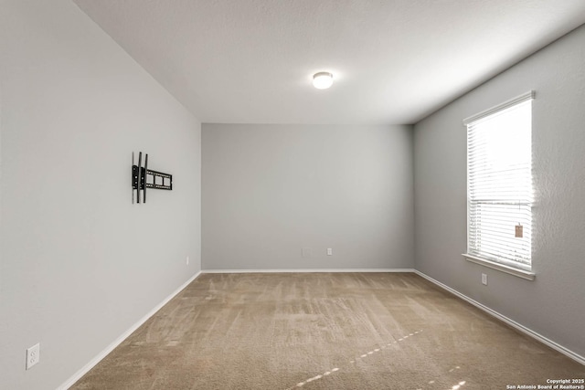 carpeted empty room featuring plenty of natural light