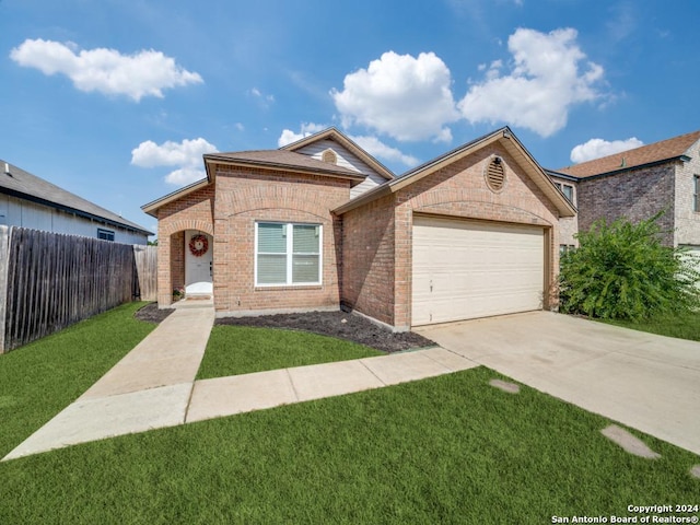 ranch-style house featuring a garage and a front yard