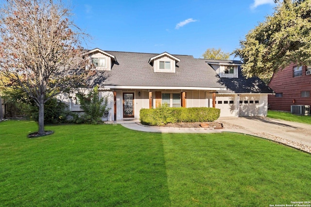 cape cod-style house featuring central AC, a front lawn, and a garage