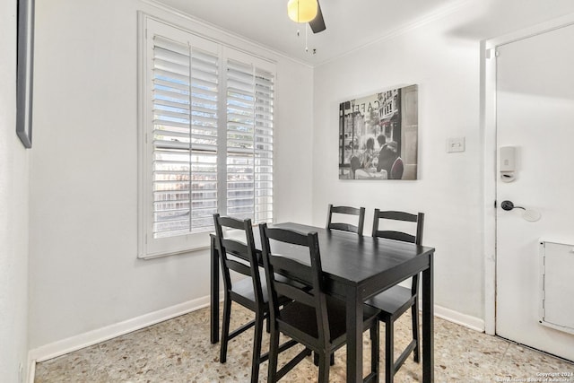 dining room featuring ceiling fan and ornamental molding