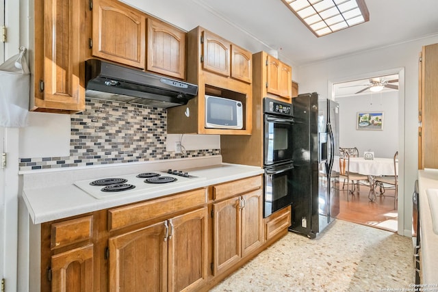 kitchen with black appliances, ceiling fan, and tasteful backsplash