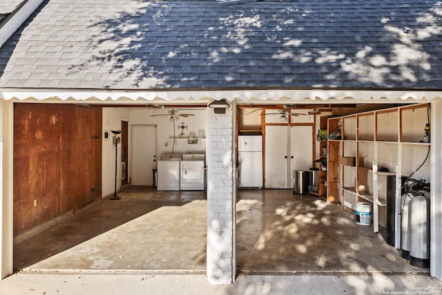 garage with separate washer and dryer, ceiling fan, and white fridge