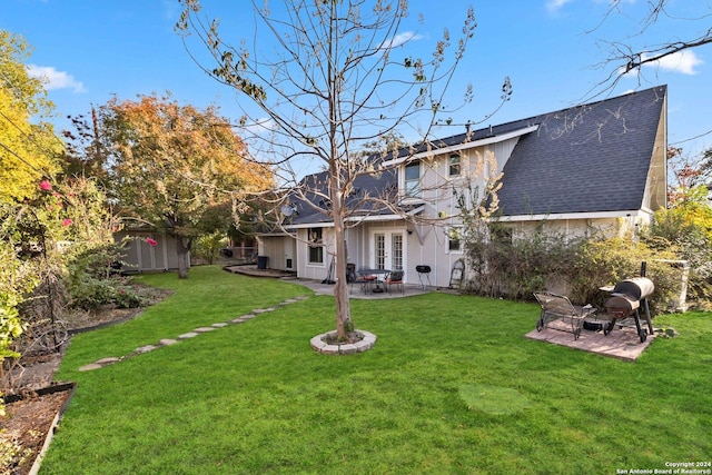 back of house featuring french doors, a yard, and a patio area