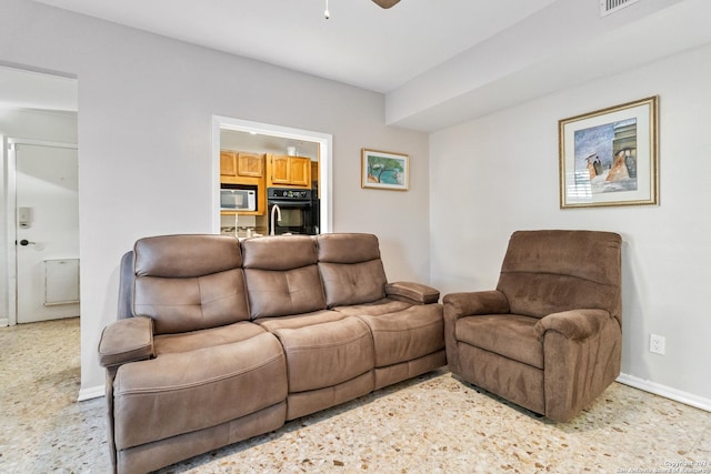 living room featuring ceiling fan