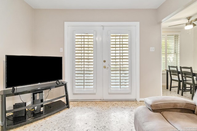 doorway featuring ceiling fan