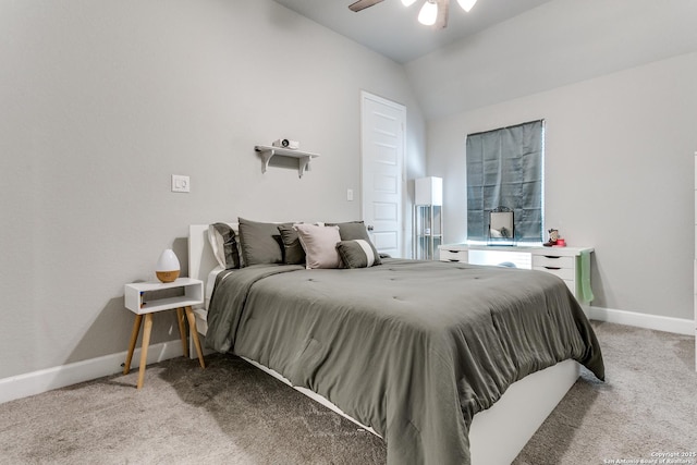 carpeted bedroom featuring ceiling fan and vaulted ceiling