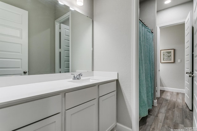 bathroom featuring vanity and hardwood / wood-style flooring