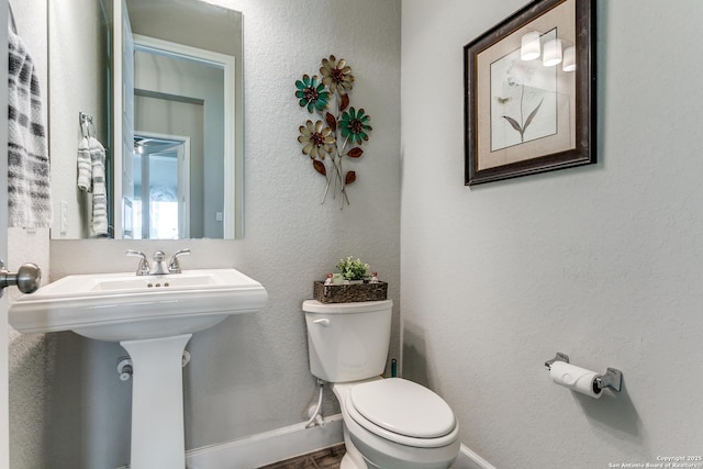 bathroom with sink and toilet