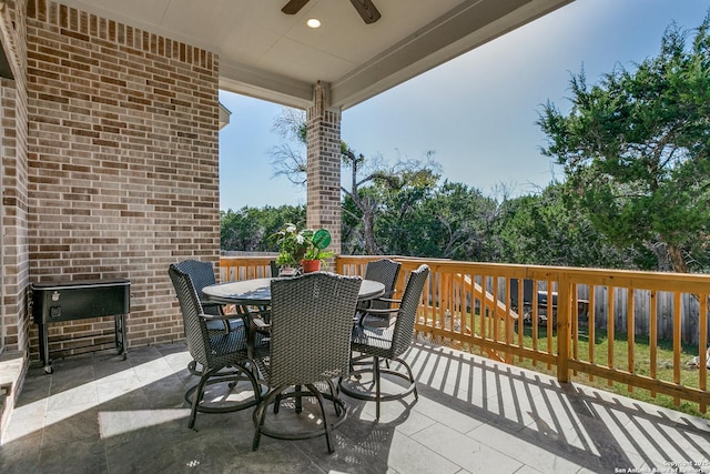 view of patio featuring ceiling fan