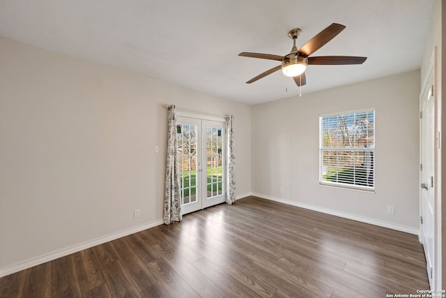 empty room featuring ceiling fan and dark hardwood / wood-style flooring