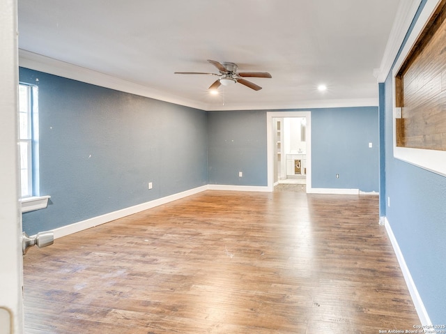 unfurnished room featuring light hardwood / wood-style floors, ceiling fan, and ornamental molding