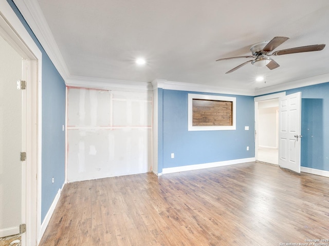 interior space with ceiling fan, wood-type flooring, and ornamental molding