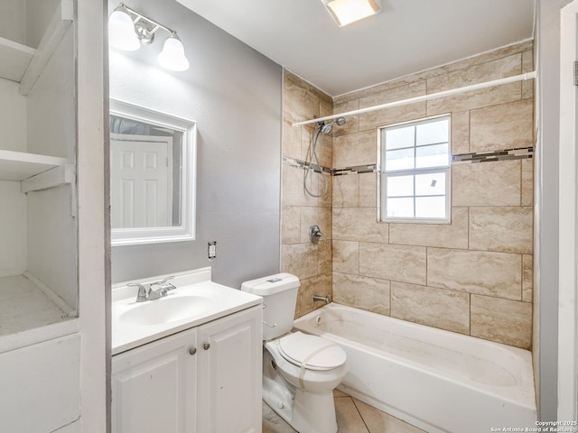 full bathroom featuring tile patterned floors, toilet, vanity, and tiled shower / bath