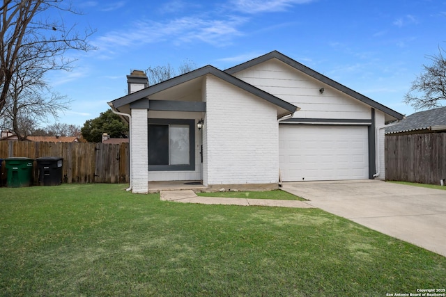 view of front facade with a front yard and a garage