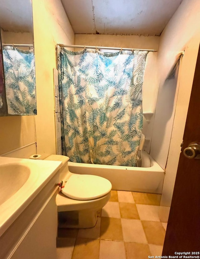 full bathroom featuring vanity, shower / bath combo, and toilet