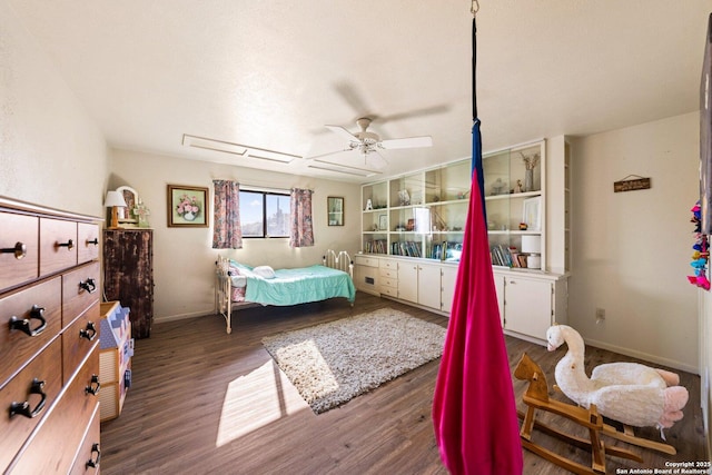 bedroom with ceiling fan and dark hardwood / wood-style floors