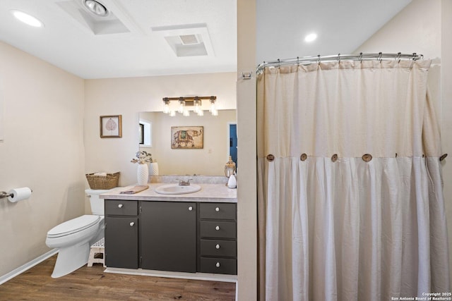 bathroom with walk in shower, vanity, wood-type flooring, and toilet