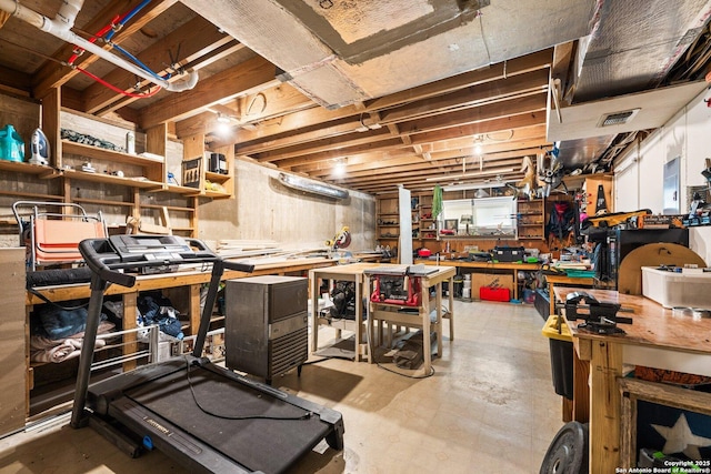 basement with a workshop area