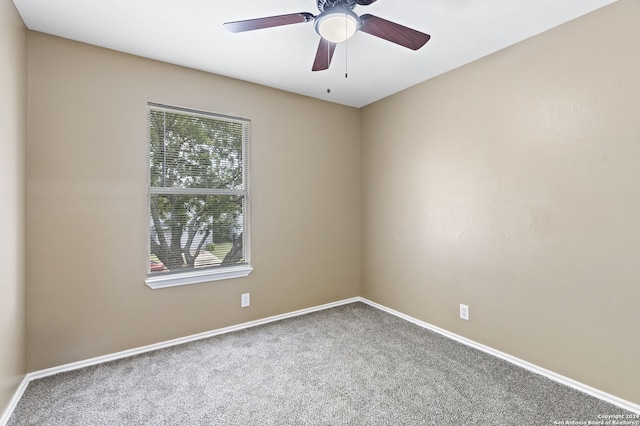 empty room featuring carpet and ceiling fan