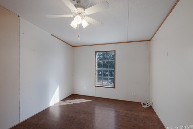 spare room featuring ceiling fan, ornamental molding, and hardwood / wood-style flooring